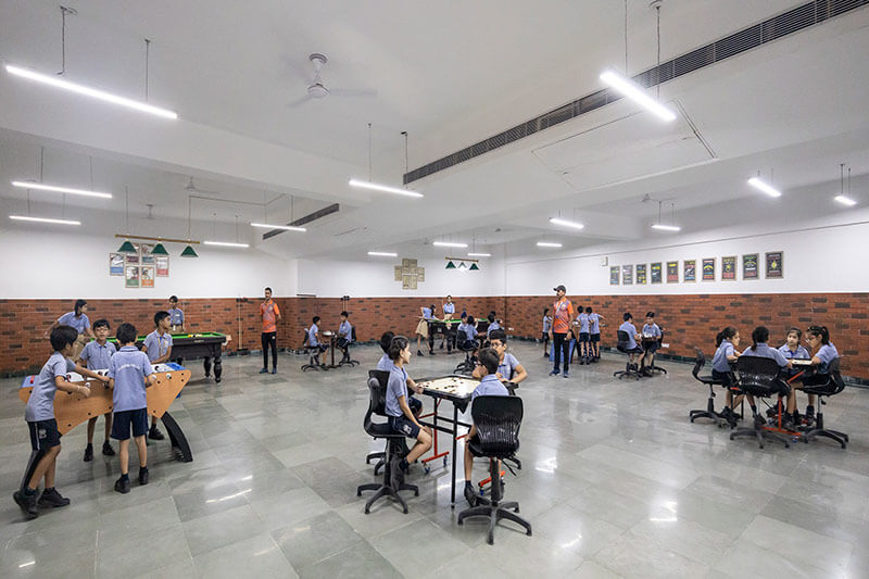 Students playing indoor games at BLS World School